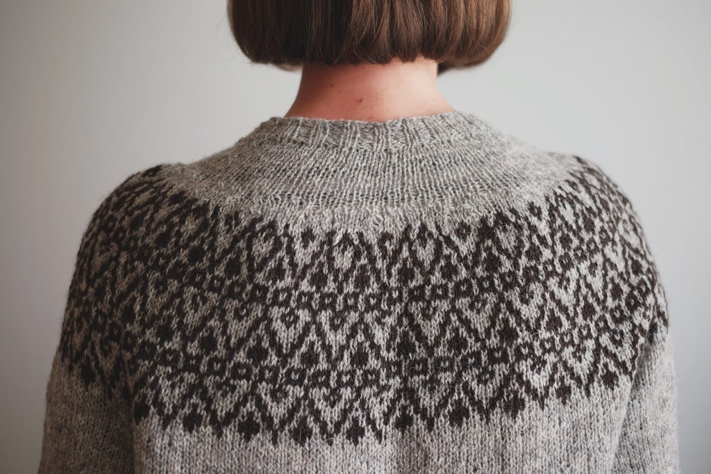The back of the yoke, modeled by Dianna. The colorwork jog is subtly visible at the center back.